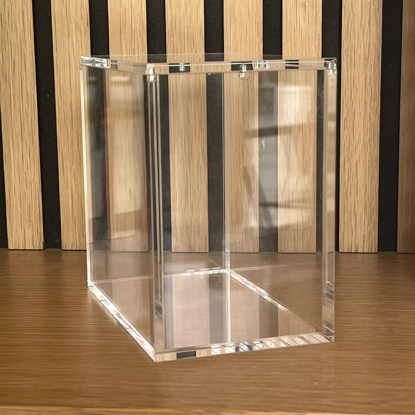View of an empty Acrylic Case for Pokemon Booster Boxes from the side.