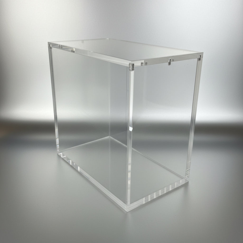 Clear acrylic cube on a white surface with a plain background