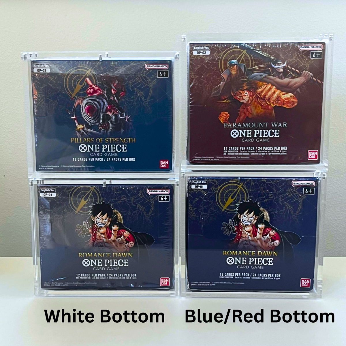 Four sealed One Piece card packs arranged in a 2x2 grid inside clear plastic cases on a white background, with text labels below indicating White Bottom and Blue/Red Bottom. Visible branding includes the One Piece franchise title and Bandai logo.