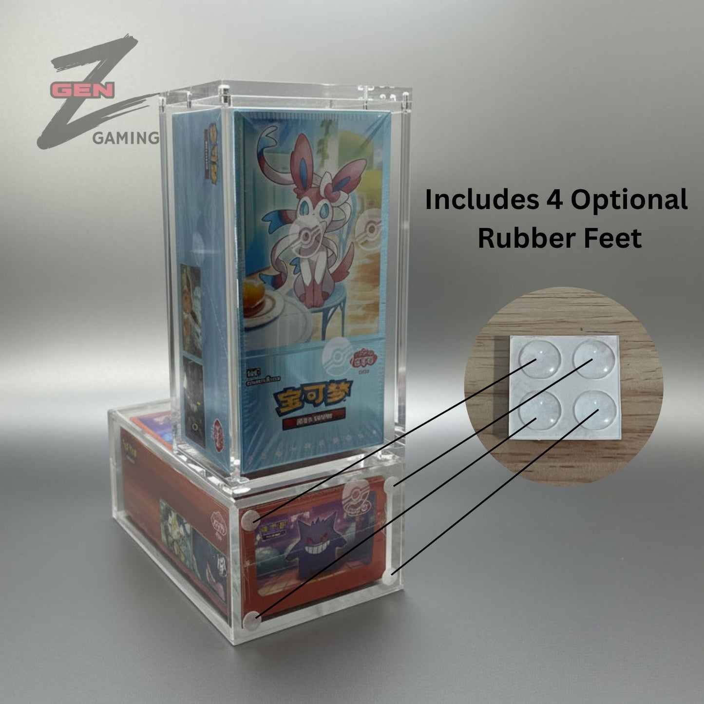 Clear acrylic display case with chinese 151C and Gem Pokemon booster boxes on a silver surface.