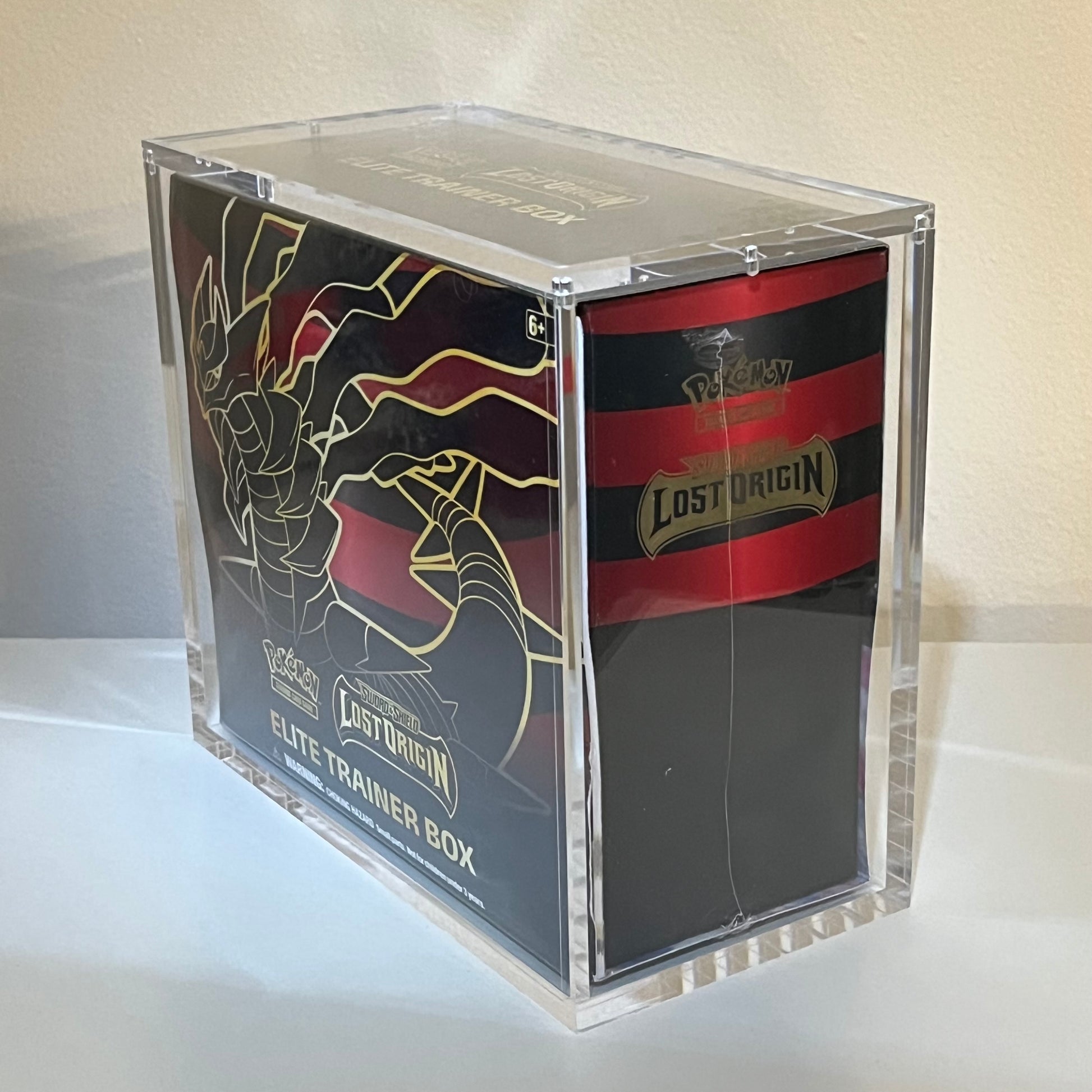 Pokémon Elite Trainer Box Lost Origin in a museum quality acrylic display case.