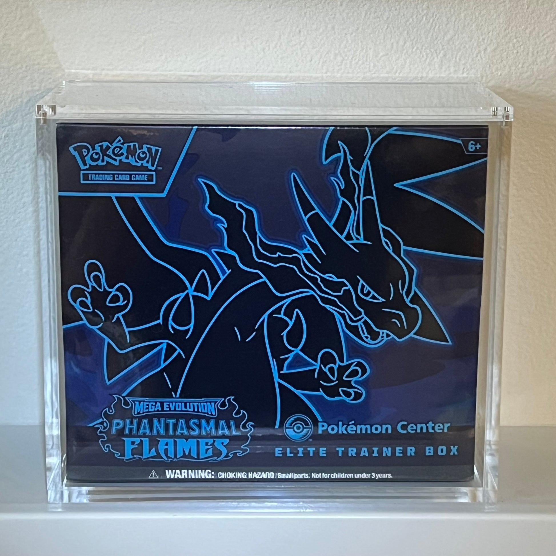 Pokémon Center Elite Trainer Box Phantasmal Flames in a museum quality acrylic display case.